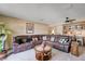 Spacious living room with comfortable seating and a built-in bar area at 775 Cathy Ln, Henderson, NV 89015