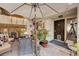Inviting outdoor patio area with comfortable seating and a large umbrella for shade at 775 Cathy Ln, Henderson, NV 89015