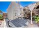 Outdoor patio featuring a dining table, seating area, and shaded pergola at 775 Cathy Ln, Henderson, NV 89015