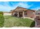 Expansive backyard featuring a covered patio perfect for outdoor entertaining at 803 Fetter Ct, Henderson, NV 89052