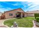 Spacious backyard with a covered patio and lush lawn, ideal for relaxation and recreation at 803 Fetter Ct, Henderson, NV 89052