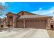 Attractive single-story home with three-car garage and desert landscaping, showcasing curb appeal at 803 Fetter Ct, Henderson, NV 89052