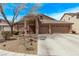 Lovely single-story home with a double-door entry and a well-manicured front yard landscape at 803 Fetter Ct, Henderson, NV 89052