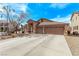 Charming single-story home showcasing a well-maintained front yard and a spacious three-car garage at 803 Fetter Ct, Henderson, NV 89052