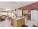 This kitchen features a breakfast bar that opens to the dining and living area at 803 Fetter Ct, Henderson, NV 89052