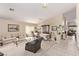 Bright living room with neutral tones and elegant dining area providing a versatile living space at 803 Fetter Ct, Henderson, NV 89052