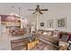 Open-concept living space featuring dining area, living room, and tile flooring at 803 Fetter Ct, Henderson, NV 89052