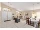 Inviting living and dining area featuring tile floors, large windows, and ample natural light at 803 Fetter Ct, Henderson, NV 89052