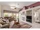 Inviting living room with a fireplace, comfortable seating, and lots of natural light at 803 Fetter Ct, Henderson, NV 89052