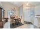 Bright dining area featuring tile floors and a modern chandelier at 841 Rusty Anchor Way, Henderson, NV 89002