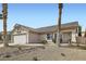 Charming single-story house featuring a tiled roof and desert-style landscaping at 841 Rusty Anchor Way, Henderson, NV 89002