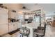 Open kitchen featuring a breakfast bar, white cabinetry, and modern appliances at 841 Rusty Anchor Way, Henderson, NV 89002