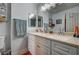 Spacious bathroom with double vanity, framed mirror, and generous counter space at 947 Rainbow Rock St, Las Vegas, NV 89123