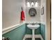 Charming powder room features pedestal sink, modern fixtures, and stylish two-tone walls at 947 Rainbow Rock St, Las Vegas, NV 89123