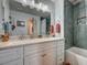 Elegant bathroom features double sinks, granite countertops, and a tiled shower-tub combo at 947 Rainbow Rock St, Las Vegas, NV 89123