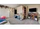 Spacious bedroom featuring storage, a work area, and carpet flooring at 947 Rainbow Rock St, Las Vegas, NV 89123