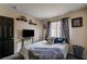 Cozy bedroom featuring a comfortable bed and natural light from the window at 947 Rainbow Rock St, Las Vegas, NV 89123