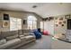 Cozy bonus room with ample natural light, vaulted ceilings, and comfortable seating area at 947 Rainbow Rock St, Las Vegas, NV 89123