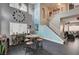Open dining area with a staircase, lounge seating, and modern decor at 947 Rainbow Rock St, Las Vegas, NV 89123