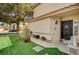 Charming home exterior with well-manicured lawn and front porch seating area at 947 Rainbow Rock St, Las Vegas, NV 89123