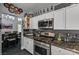 Modern kitchen features granite counters, stylish backsplash, and stainless steel appliances at 947 Rainbow Rock St, Las Vegas, NV 89123