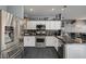 Well-equipped kitchen with stainless steel appliances, granite countertops, and lots of storage at 947 Rainbow Rock St, Las Vegas, NV 89123