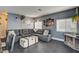 Cozy living room with a large sectional sofa, white storage trunk, and stylish decor at 947 Rainbow Rock St, Las Vegas, NV 89123