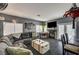 Comfortable living room with a fireplace, sliding glass doors, and an open connection to the kitchen at 947 Rainbow Rock St, Las Vegas, NV 89123