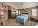 Bright main bedroom with ensuite bathroom and wood-look floors at 947 Rainbow Rock St, Las Vegas, NV 89123