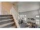 Open staircase leads to a bright living area with dining space and large windows at 947 Rainbow Rock St, Las Vegas, NV 89123