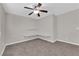 Bedroom features carpet, ceiling fan, and display shelving at 963 Sable Chase Pl, Henderson, NV 89011
