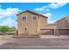 The rear of the home features a two-car garage and desert landscaping at 963 Sable Chase Pl, Henderson, NV 89011
