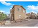 The rear of the home features a two-car garage and desert landscaping at 963 Sable Chase Pl, Henderson, NV 89011
