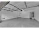 View of a clean, spacious garage with epoxy flooring and plenty of room for storage at 963 Sable Chase Pl, Henderson, NV 89011