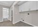 Convenient laundry room featuring washer and dryer hookups and built-in cabinets at 963 Sable Chase Pl, Henderson, NV 89011