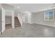Open living area with tile floors, staircase, and bright natural lighting at 963 Sable Chase Pl, Henderson, NV 89011