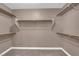 Functional walk-in closet with built-in shelving and carpeted floor at 963 Sable Chase Pl, Henderson, NV 89011