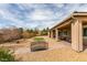 The backyard has low-maintenance landscaping, an artifical lawn and a covered patio at 9731 Addie Meadow Ct, Las Vegas, NV 89149