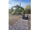 Backyard featuring rock landscaping, stone pathway, decorative bridge, and gazebo at 9731 Addie Meadow Ct, Las Vegas, NV 89149