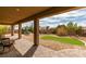 Serene backyard features a covered patio, low maintenance landscaping, and a gazebo in the distance at 9731 Addie Meadow Ct, Las Vegas, NV 89149