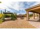 Expansive backyard featuring a charming gazebo, decorative bridge, and covered patio at 9731 Addie Meadow Ct, Las Vegas, NV 89149