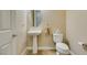Half bath featuring a pedestal sink and white toilet at 9731 Addie Meadow Ct, Las Vegas, NV 89149