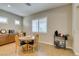 Cozy breakfast nook with round table, granite countertop, and natural light from the window at 9731 Addie Meadow Ct, Las Vegas, NV 89149