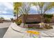Elegant community entrance sign surrounded by lush landscaping at 9731 Addie Meadow Ct, Las Vegas, NV 89149