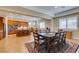 Dining room with tile floors adjacent to a modern kitchen with stainless steel appliances and an island at 9731 Addie Meadow Ct, Las Vegas, NV 89149