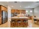 Spacious kitchen with stainless steel appliances, granite countertops and kitchen island seating at 9731 Addie Meadow Ct, Las Vegas, NV 89149