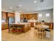 Well-equipped kitchen features a central island, granite countertops, stainless steel appliances, and breakfast area at 9731 Addie Meadow Ct, Las Vegas, NV 89149