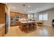 Modern kitchen featuring a large island with seating, stainless steel appliances, and granite countertops at 9731 Addie Meadow Ct, Las Vegas, NV 89149