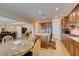 Spacious kitchen with island, stainless steel appliances, and breakfast area, leading to a large living area at 9731 Addie Meadow Ct, Las Vegas, NV 89149