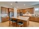 Well-appointed kitchen with granite counters, stainless steel appliances, large island with seating at 9731 Addie Meadow Ct, Las Vegas, NV 89149